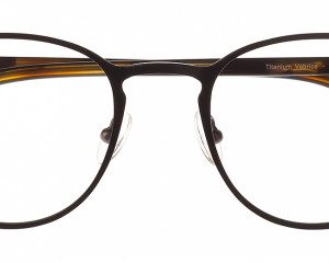 Brown tortoiseshell round eyeglasses with clear lenses, metal bridge, and adjustable nose pads seen from the front.
