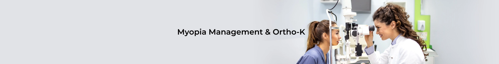 Banner in a clinical setting with an optometrist examining a patient's eye using diagnostic equipment; heading reads 'Myopia Management & Ortho-K'
